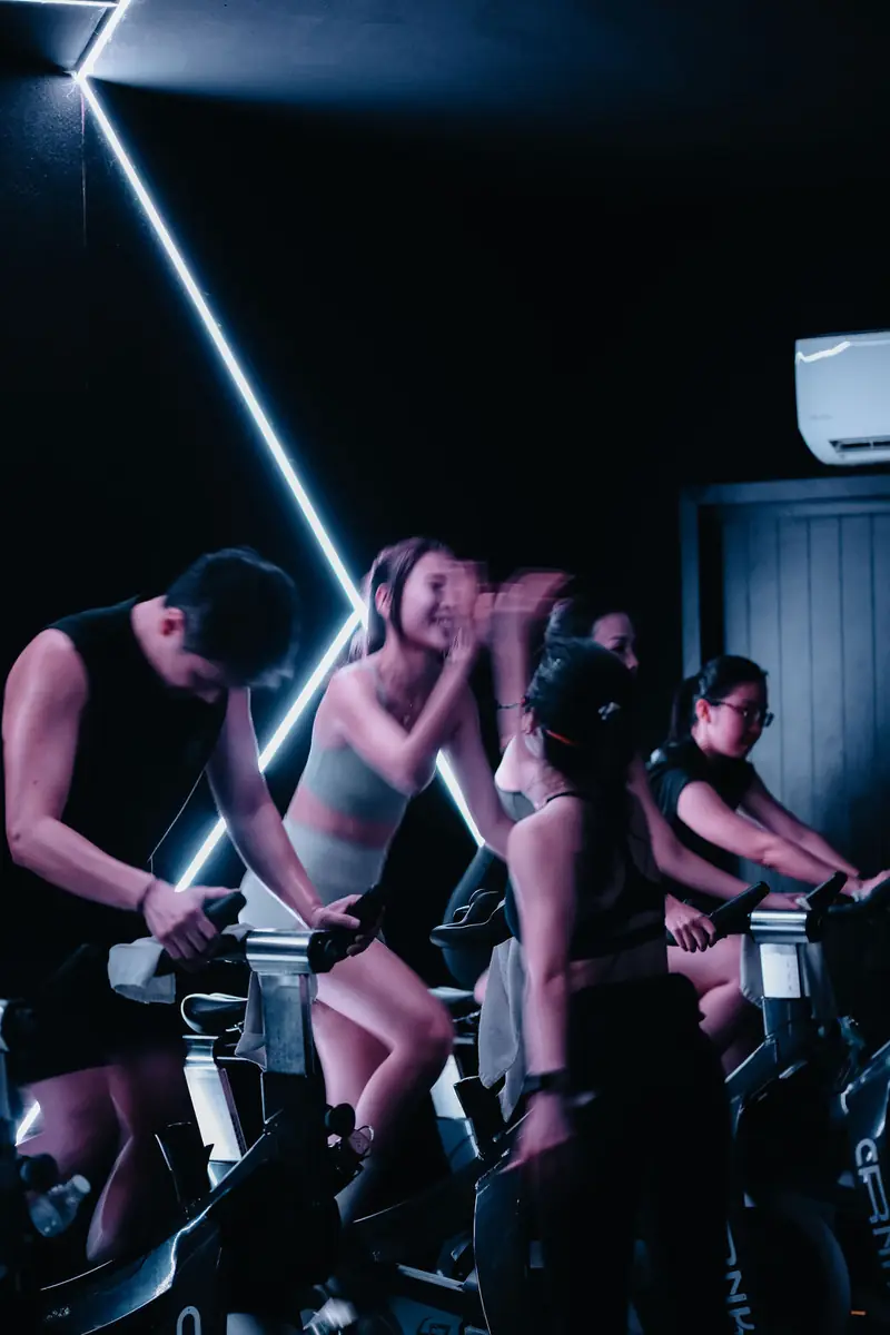Riders under neon light lines