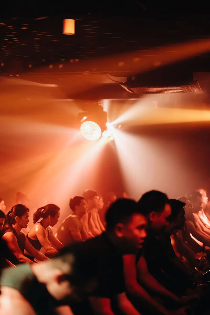 Riders under an orange light burst